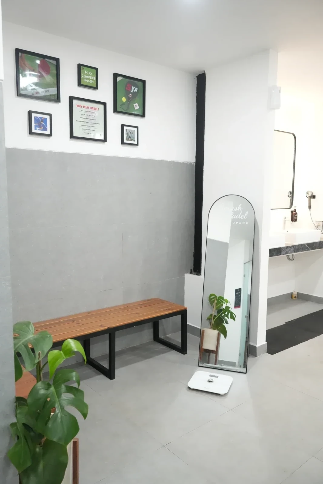 Stylish bathroom interior with plants and wall art decoration