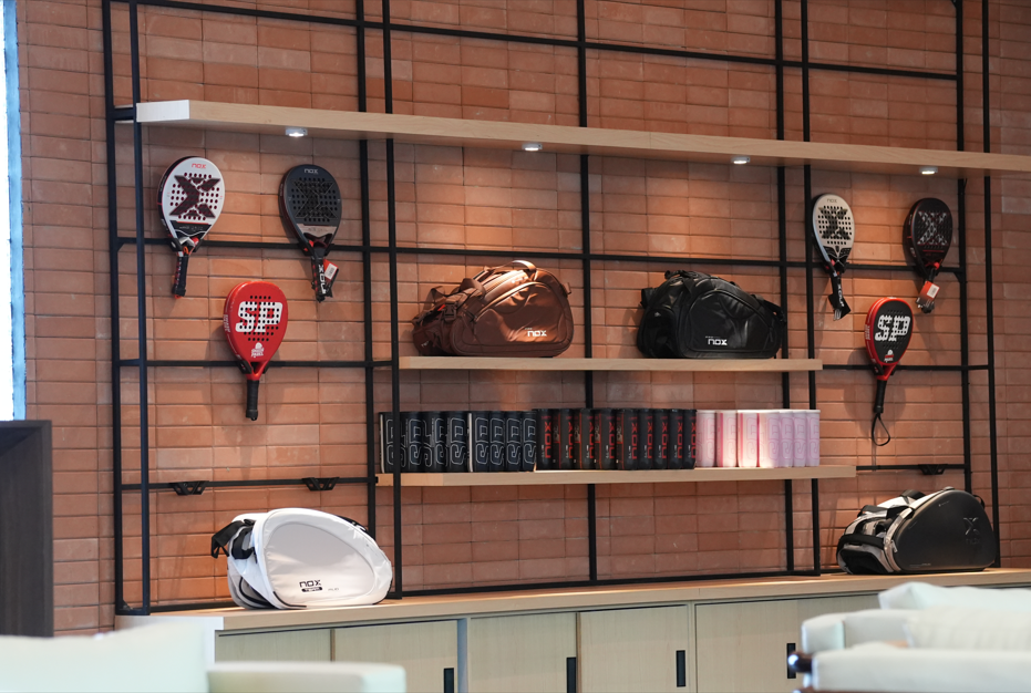 Pro shop merchandise wall with equipment and apparel